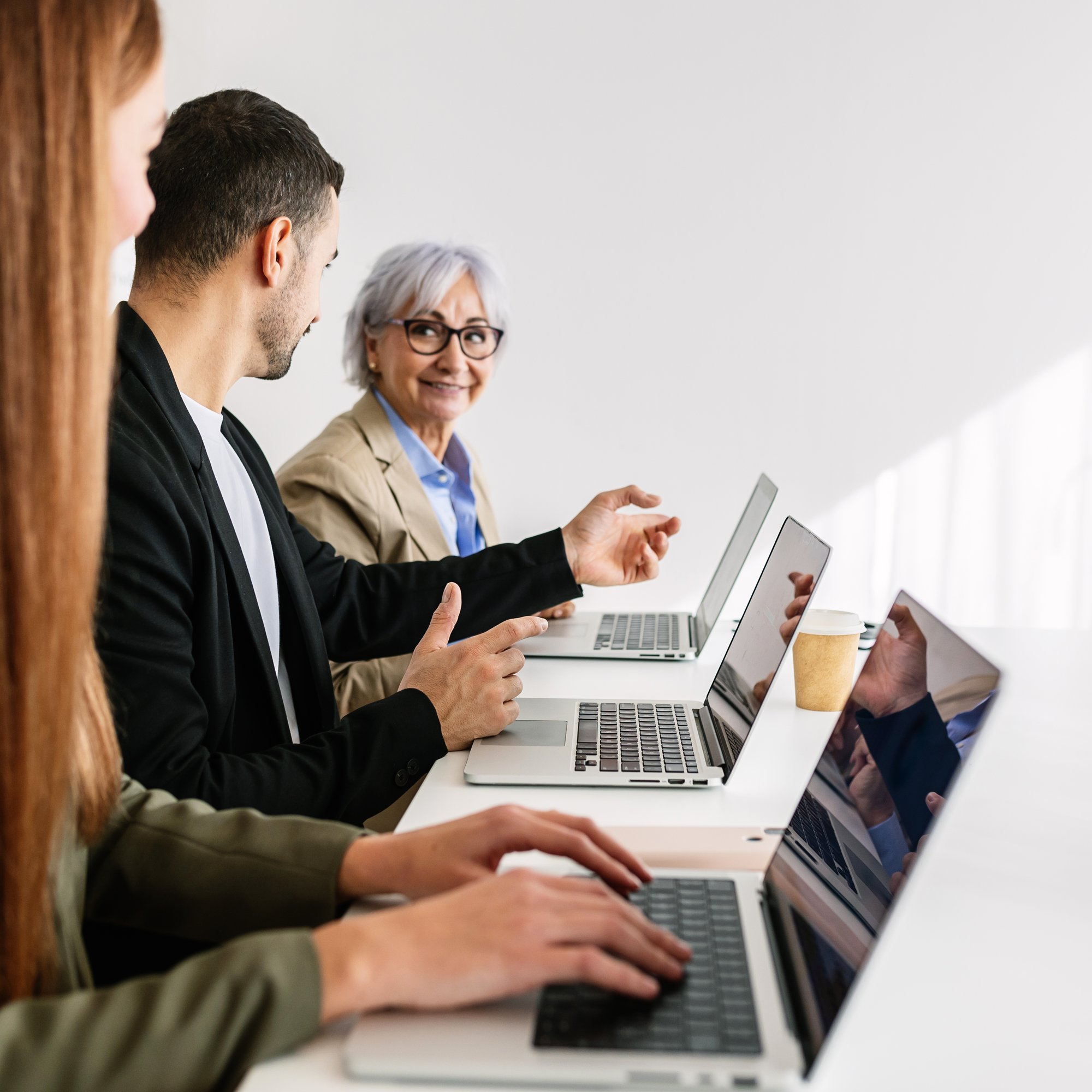 business-team-working-together-on-laptop-in-office-2026-01-09-00-02-52-utc